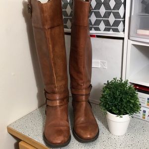 Brown tall boots.